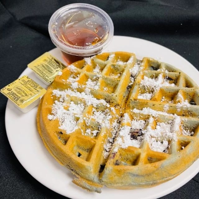 Blueberry Waffle Dusted with Powdered Sugar.