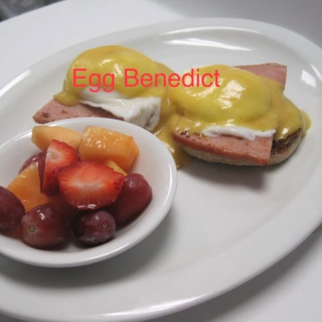HAM Eggs Benedict Plate with Fruit Cup.