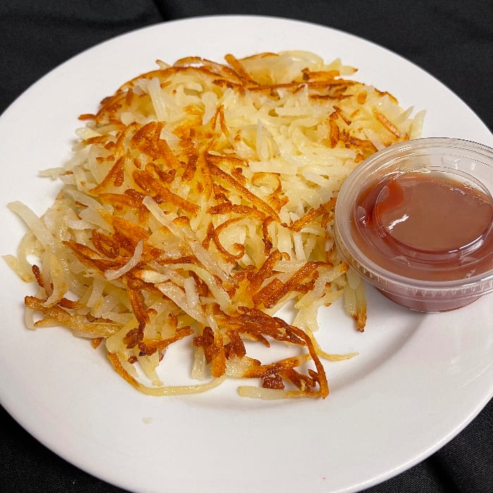 Hash brown with ketchup.