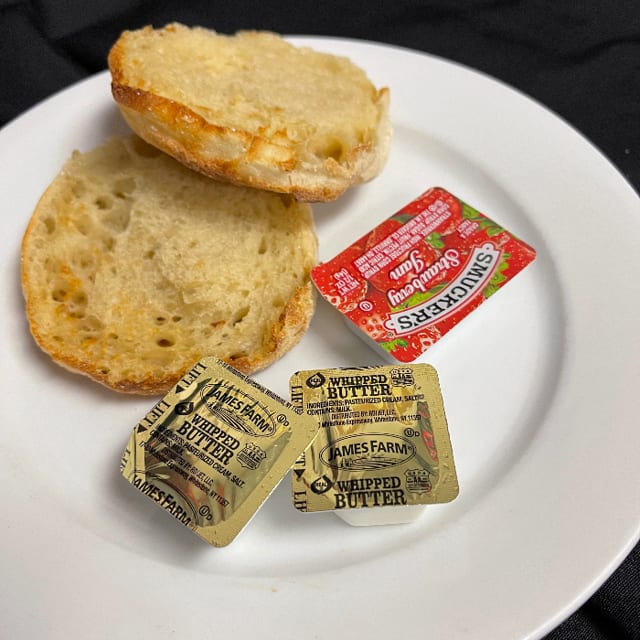 English muffin with butter and jelly.