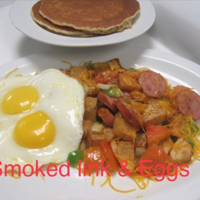 Smoked Link and Eggs Plate with 2 Pancakes.
