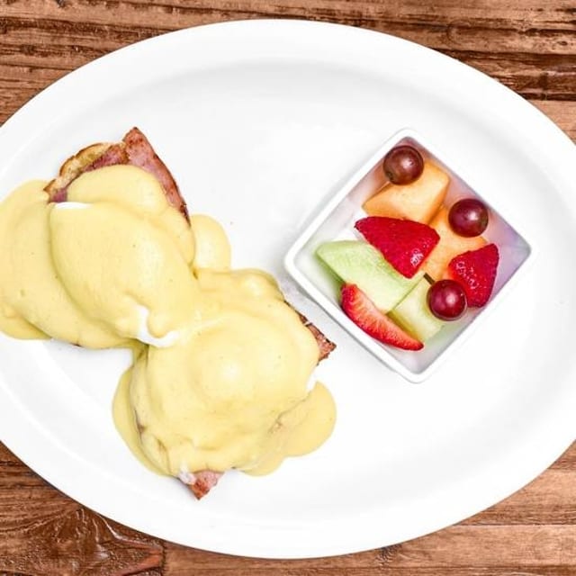 CORN BEEF HASH EGGS BENEDICT with FRUIT CUP.
